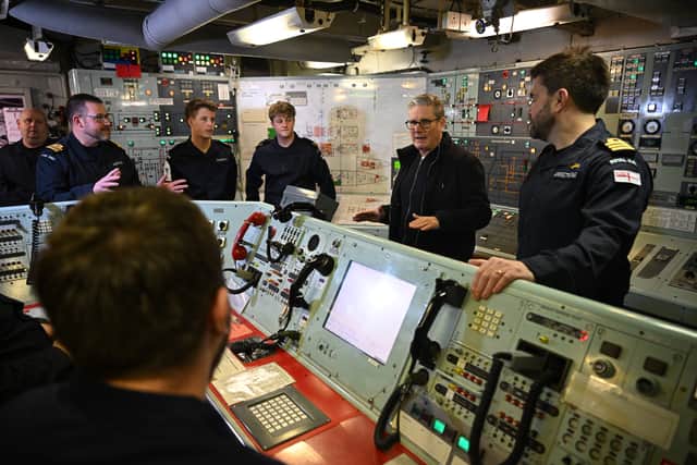 Prime Minister Sir Keir Starmer speaks with crew in the Control Room as he tours HMS Iron Duke.