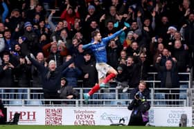 Pompey's in-form Callum Lang has promised he has happy to stay at Fratton Park, amid his flying form. Pic: PA
