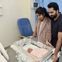 Kripa Baby, 28,and her husband Basil Kurian, 29, from Waterlooville, with their daughter Elora Basil, who was the first baby to be born at QA Hospital on Christmas Day at 5.17am. Picture: Sarah Standing (261224-8071)