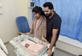 Kripa Baby, 28,and her husband Basil Kurian, 29, from Waterlooville, with their daughter Elora Basil, who was the first baby to be born at QA Hospital on Christmas Day at 5.17am. Picture: Sarah Standing (261224-8071)