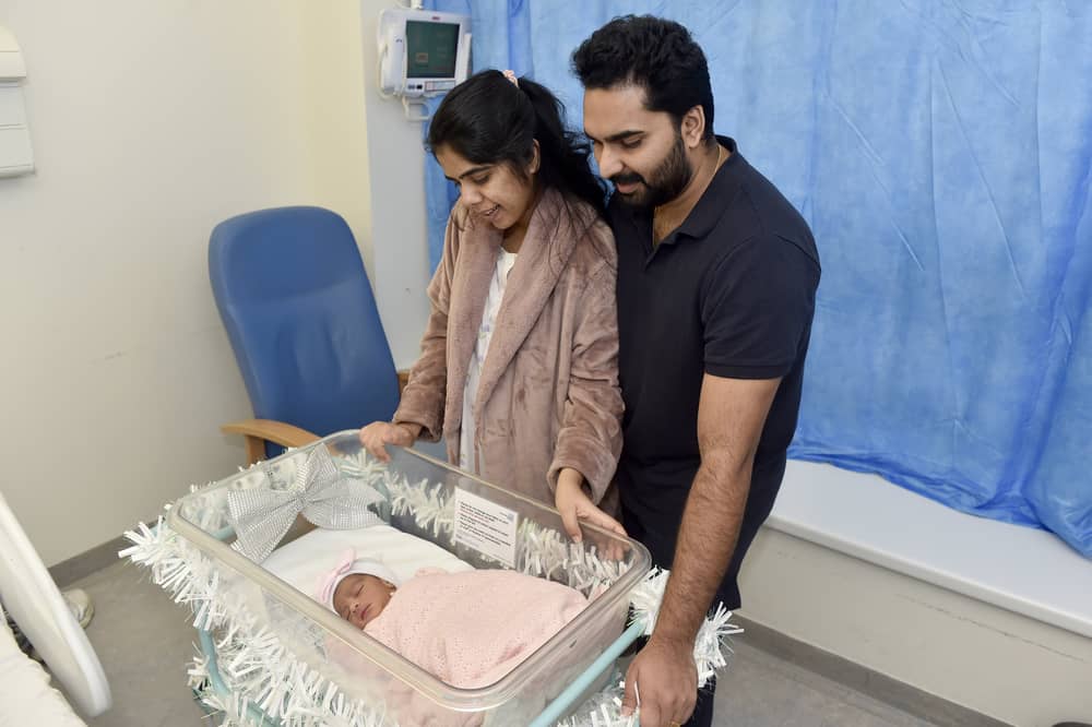 Kripa Baby, 28,and her husband Basil Kurian, 29, from Waterlooville, with their daughter Elora Basil, who was the first baby to be born at QA Hospital on Christmas Day at 5.17am. Picture: Sarah Standing (261224-8071)