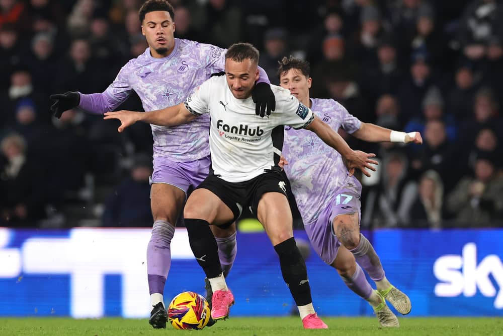 Gancalo Franco, pictured behind Swans team-mate Myles Peart-Harrisn during a recent game against Derby