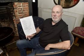 Landlord of The Square Cow in Wickham, Frank Dixie, was surprised when a chair stolen from outside the pub was returned with a poem of apology. Picture: Sarah Standing (311224-8143)
