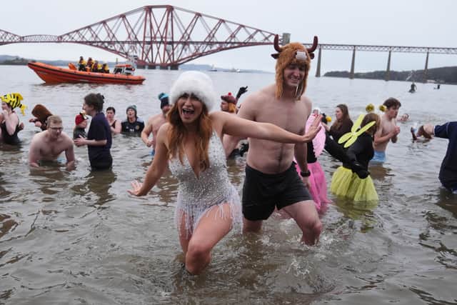 Revellers brave the chilly start to the New Year with a little Loony Dook in the Firth of Forth near Edinburgh.