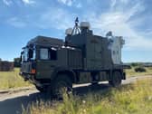 A truck mounted, Radio Frequency Directed Energy Weapon (RFDEW) development system that can detect, track and engage a range of threats across land, air and sea. British soldiers have successful trialled for the first time the game-changing weapon that can take down a swarm of drones using radio waves for less than the cost of a pack of mince pies.