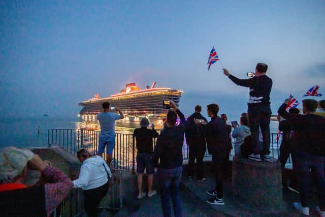 Cruise ship Scarlet Lady will be returning to Portsmouth for the first time since 2021. Pictured are residents watching her depart on September 3, 2021, at The Round Tower in Old Portsmouth.