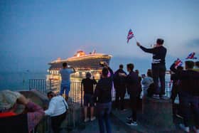 Cruise ship Scarlet Lady will be returning to Portsmouth for the first time since 2021. Pictured are residents watching her depart on September 3, 2021, at The Round Tower in Old Portsmouth.