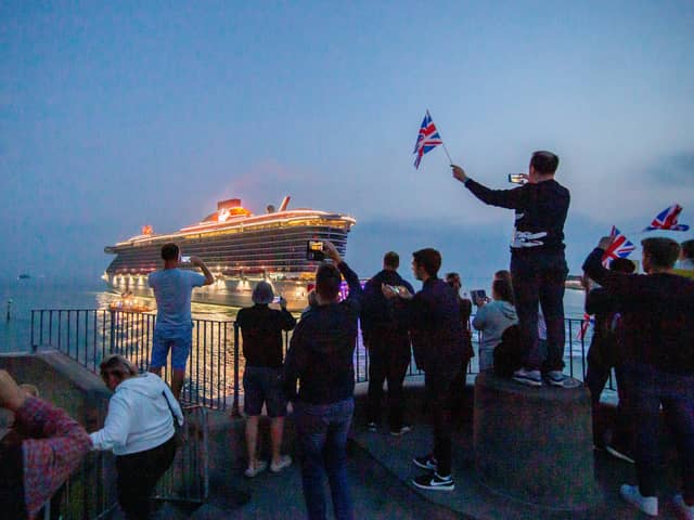 Cruise ship Scarlet Lady will be returning to Portsmouth for the first time since 2021. Pictured are residents watching her depart on September 3, 2021, at The Round Tower in Old Portsmouth.