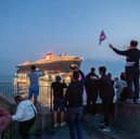Cruise ship Scarlet Lady will be returning to Portsmouth for the first time since 2021. Pictured are residents watching her depart on September 3, 2021, at The Round Tower in Old Portsmouth.