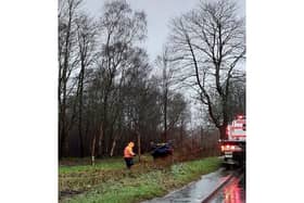 A car overturned after driving into standing water on a flooded section of the A3 near Bramshott.