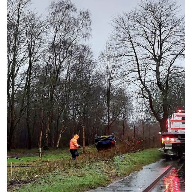 A car overturned after driving into standing water on a flooded section of the A3 near Bramshott.