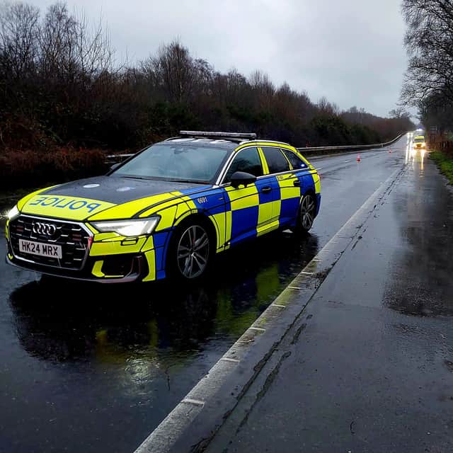 Police closed off a section of the A3 southbound near Bramshott after a car overturned when driving into a flooded section.