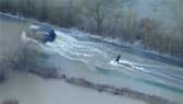 Man wakeboards along flooded road in Leicestershire.