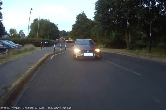 Shocking dash cam footage shows the moment a man crashes into a police motorcyclist.