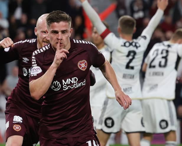 Hearts midfielder Cammy Devlin has been linked with a move to Pompey