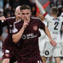 Hearts midfielder Cammy Devlin has been linked with a move to Pompey