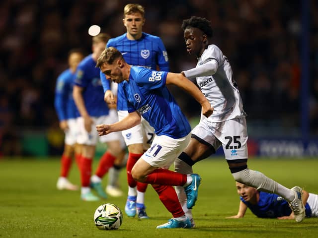 Romain Esse (R) could be set for a move to the Premier League after playing Pompey. The Millwall star is wanted by Crystal Palace. 