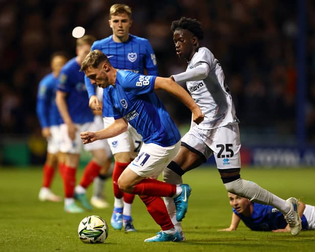 Romain Esse (R) could be set for a move to the Premier League after playing Pompey. The Millwall star is wanted by Crystal Palace. 