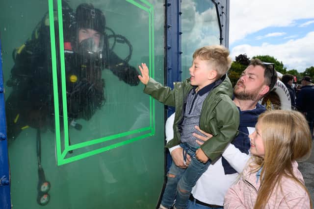 Calum, Louie and Mia Osted having fun at the HMS Collingwood Open Day last Summer.