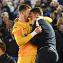 Will Norris and Pompey boss John Mousinho celebrate the League One title win against Barnsley.