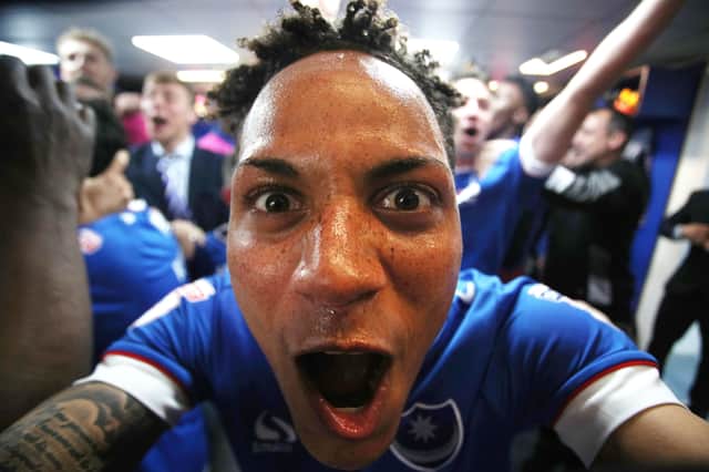 Kyle Bennett leads Pompey's League Two title celebrations in the Fratton Park changing room in May 2017. Picture: Joe Pepler