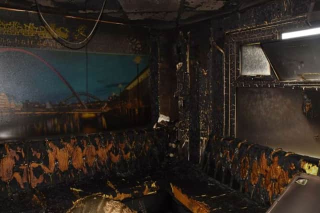 Damage to the barber shop following the attack.