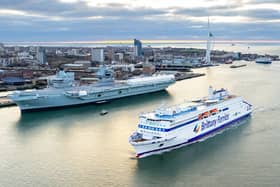Brittany Ferries' newest vessel, the LNG-powered Saint Malo, sailing into Portsmouth International Port for sea trials - travelling past HMS Prince of Wales.