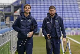 Ryley Towler, left, and Callum Lang head for the Fratton Park dressing room ahead of the Blues' game against Middlesbrough today