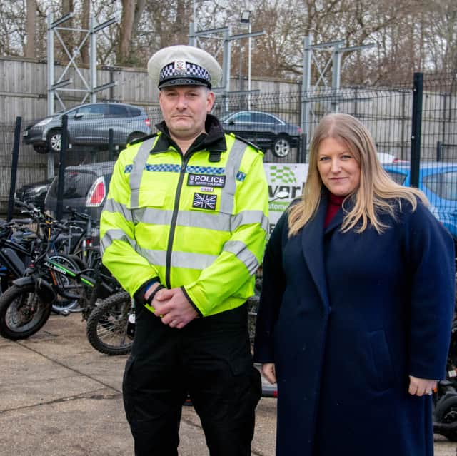 Road Safety Sergeant Jamie Dobson and Donna Jones near the seized motorcycles and scooters at Silverlake Garage
