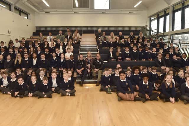 Pictured is: (middle l-r) Roy Bedlow, CEO and founder of Low Carbon, Kathryn Wilden, headteacher and Sir Ben Ainslie with some of the Year 3 and Year 6 pupils.