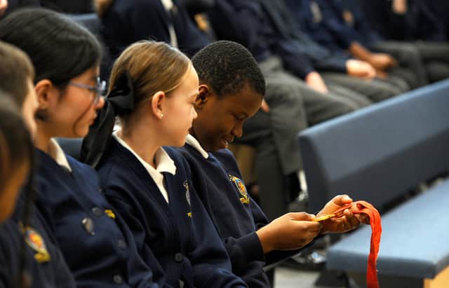 Pupils got the chance to look at Sir Ben Ainslie's Olympic medals. Picture: Sarah Standing (170125-1622)