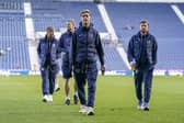 The Pompey players inspect the Hawthorns pitch before today's game against West Brom