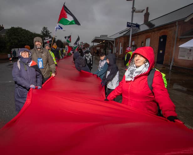 Over a hundred of pro-Palestine protesters marched from Fratton to Portsmouth City Centre with half-a-kilometre-long piece of red fabric as part of The Red Line march for Palestine