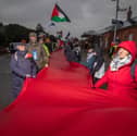 Over a hundred of pro-Palestine protesters marched from Fratton to Portsmouth City Centre with half-a-kilometre-long piece of red fabric as part of The Red Line march for Palestine