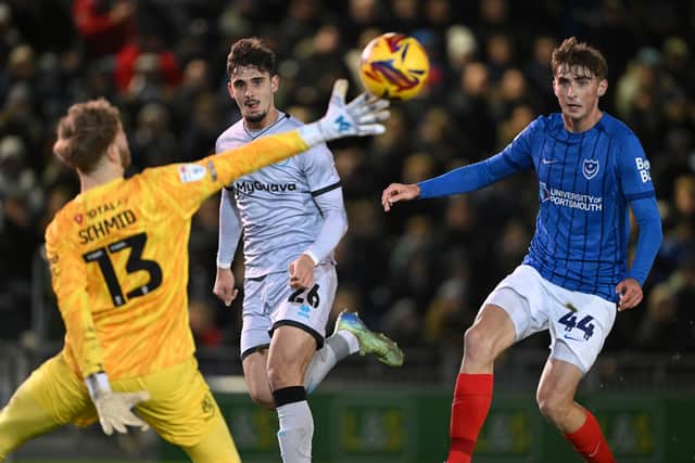 Mihailo Ivanovic chips the ball last Nicolas Schmid for Millwall's winner against Pompey at Fratton Park