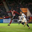 Millenic Alli is being linked with a move to Luton Town. He's currently with Exeter City. 