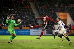 Millenic Alli is being linked with a move to Luton Town. He's currently with Exeter City. 