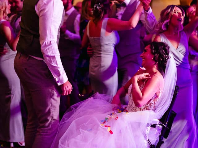 A bride given less than six months to live after losing her leg to cancer made it down the aisle to marry her partner -for the second time. 