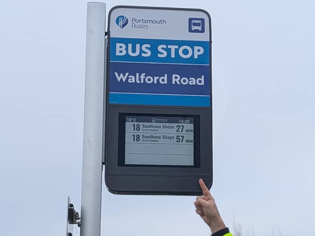 Councillor Peter Candlish, Portsmouth's Cabinet Member for Transport with the new bus signs