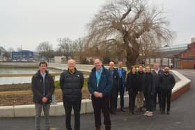 Front centre: Cllr Leader and Forton Ward Councillor Peter Chegwyn, standing next to (left) Steve Fitzmaurice, Engineering Team Manager for Coastal Partners, and (right) Alister Butcher, Director of Estates and Safety at Lighthouse Learning Trust.

Back: Representatives from Coastal Partners, the construction team and the Environment Agency at the completed Forton defences.