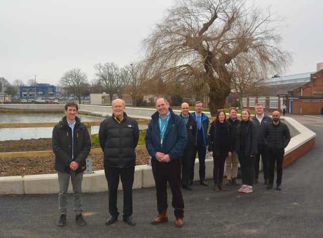 Front centre: Cllr Leader and Forton Ward Councillor Peter Chegwyn, standing next to (left) Steve Fitzmaurice, Engineering Team Manager for Coastal Partners, and (right) Alister Butcher, Director of Estates and Safety at Lighthouse Learning Trust.
Back: Representatives from Coastal Partners, the construction team and the Environment Agency at the completed Forton defences.