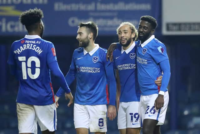 Ben Close (centre-left) won promotion to League One with Pompey. He's a product of the academy.