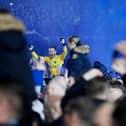 Will Norris celebrates Pompey's League One title success after an unforgettable night against Barnsley at Fratton Park last April