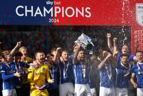 Will Norris (L) is leaving Pompey less than a year after playing a key role in their League One title win. He's returning to the division to try and win promotion for a second year running. 