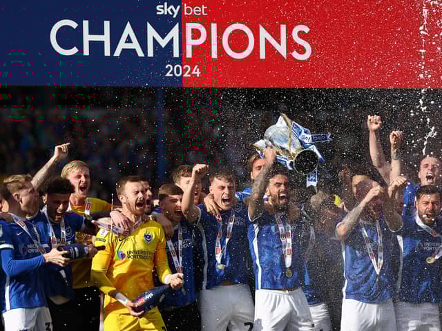 Will Norris (L) is leaving Pompey less than a year after playing a key role in their League One title win. He's returning to the division to try and win promotion for a second year running. 