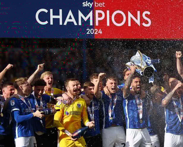 Will Norris (L) is leaving Pompey less than a year after playing a key role in their League One title win. He's returning to the division to try and win promotion for a second year running. 
