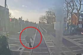 Woman comes within ‘half a second’ of being struck by train at level crossing.