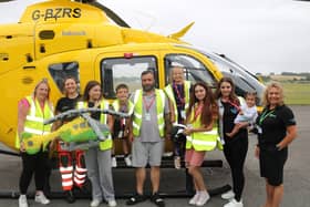 The Dowling family with Hampshire & Isle of Wight Air Ambulance specialist paramedic Clare Fitchett and aftercare manager Nikki Harris.