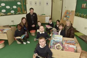 Manor Infant and Nursery School in Inverness Road, Portsmouth, has opened its new library. 

Pictured is: (back left) Helen Castle, headteacher, Councillor Dave Ashmore and (right) governor Patsy Thompson with some of the young MP's of the school.

Picture: Sarah Standing (310125-9137)
