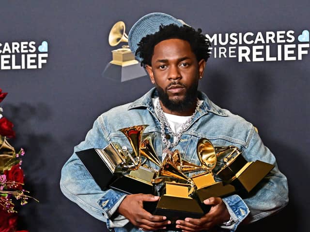 Kendrick Lamar poses with the Record Of The Year, Best Rap Performance, Song Of The Year, Best Music Video, Best Rap Song awards in the press room during the 67th Annual Grammy Awards.     